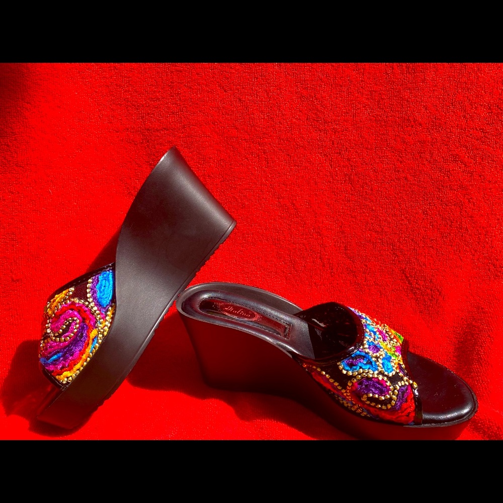 Italian black and multi colored slip ons with a slight platform.